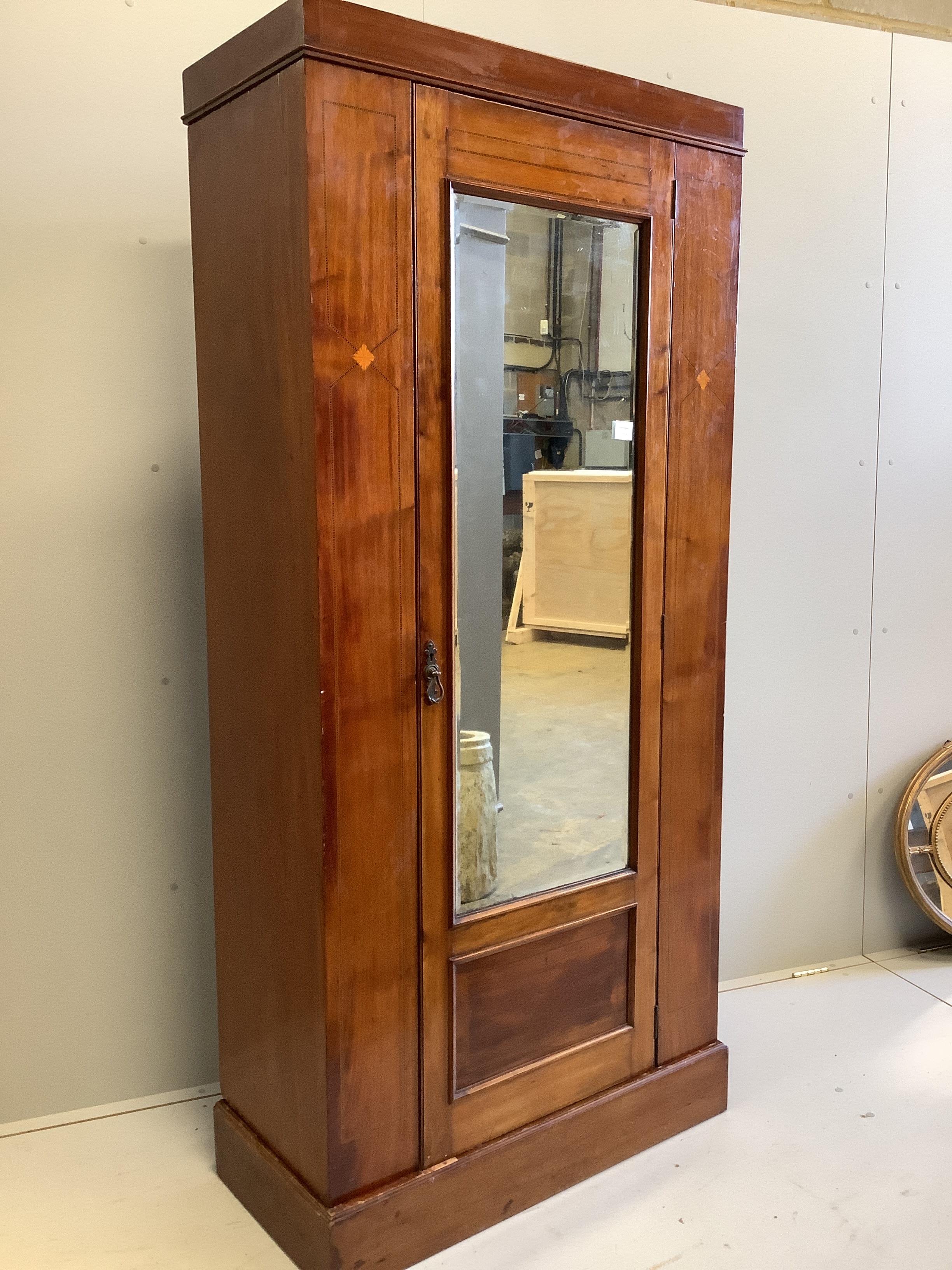 An Edwardian mahogany single wardrobe, width 90cm, depth 43cm, height 196cm